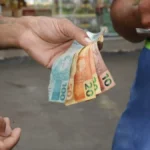 Brazil cuts key interest rate to 14.25 pct in third straight reduction